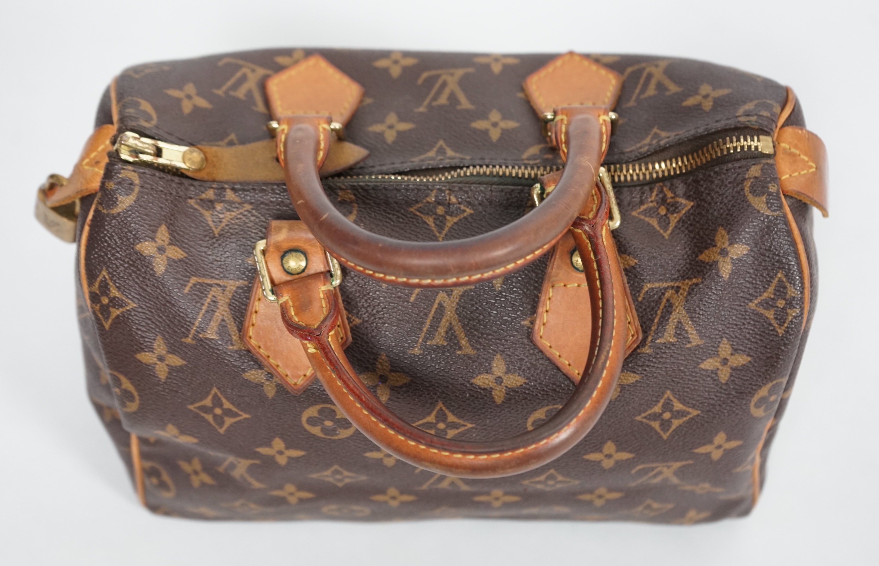 A vintage Louis Vuitton Monogram canvas Speedy 25 handbag, a Louis Vuitton Pochette Accessories Canvas bag and small Agenda PM Speedy bag: width 25cm, height overall 29cmm depth15cm, Pochette Bag: width 22cm, height 13cm